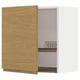 A wooden kitchen cabinet with an open door, revealing metal racks inside.