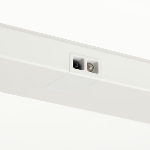 Close-up of clean, modern drawer light. Shows two sensors on white surface.