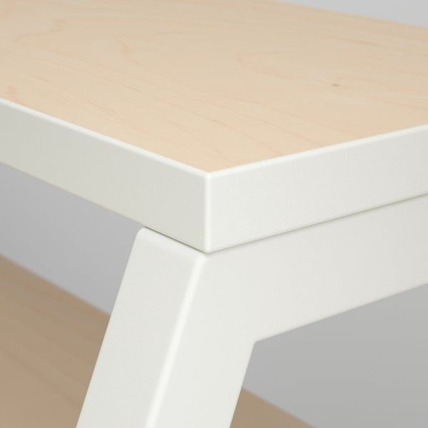 A sleek, modern desk with a smooth, light wood top and crisp white edges, showing fine craftsmanship and quality materials.