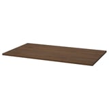 The MITTZON table top is dark brown, rectangular, and made from walnut veneer. Its designed for easy cleaning.
