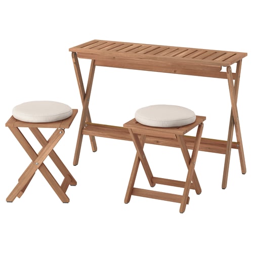 A NÄMMARÖ outdoor furniture set in brown. It includes a rectangular foldable table and two stools with white cushions.