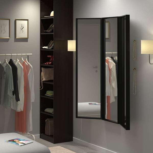 NISSEDAL trinity mirror set in black, large, floor-to-ceiling, reflecting bedrooms wardrobe and bed, with dark frame, modern design.