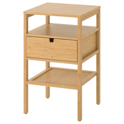 A NORDKISA bamboo bedside table with a single drawer and open shelves, light brown colour.