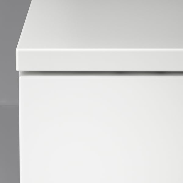Smooth, white NORDLI drawer; clean lines, quality finish.