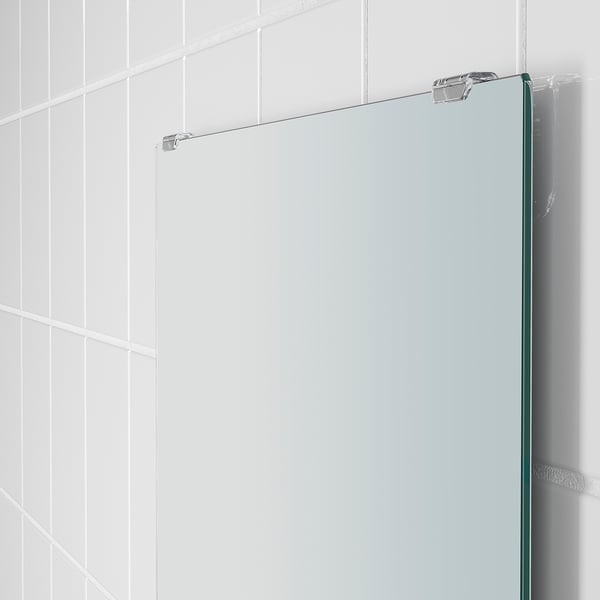 Modern glass shower door with sturdy metal hinges. Clear, sleek design for elegant bathrooms.