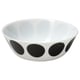 A white ceramic bowl with black circular dots along the sides.