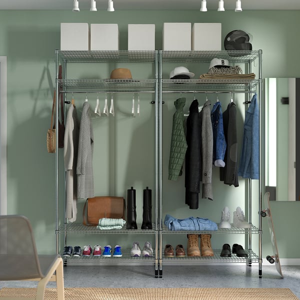 Closet organiser with clothes rail, shelves, and storage boxes.