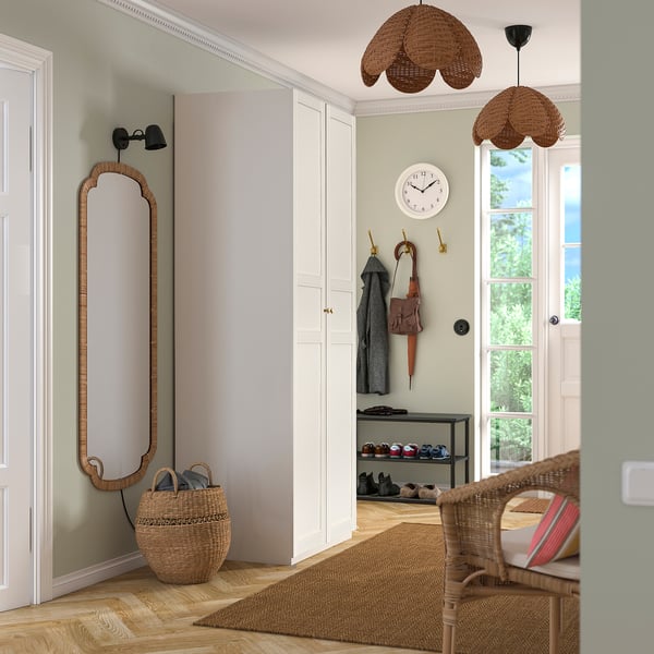 Entryway with white PAX wardrobe, mirror, pendant light, shoe rack, and baskets.