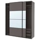 Modern PAX wardrobe in dark grey with mirrored doors and interior storage baskets.