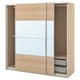 An ikea PAX wardrobe in light oak color with mirrored sliding doors. It adjustable feet, an internal mesh basket, and soft-closing mechanisms.