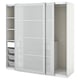 White PAX wardrobe with glass doors, sliding rails, and inner shelves.