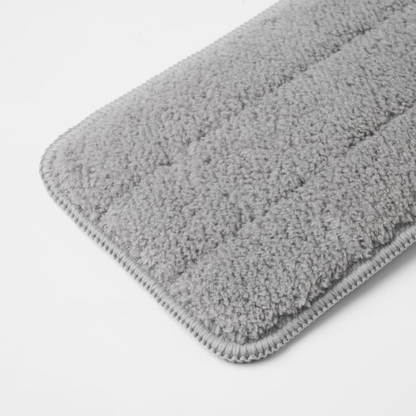 Close-up of absorbent, textured microfiber cloth, folded neatly, showcasing its soft, plush surface and durable edge stitching.