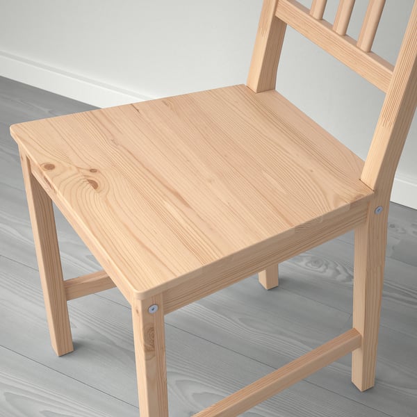 Natural wood chair. Light tan finish. Vertical slatted back. Sturdy, simple design.