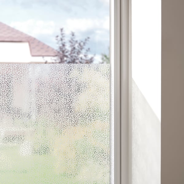 Clear window film provides privacy, letting daylight in while obscuring outside view. Fits various window sizes.