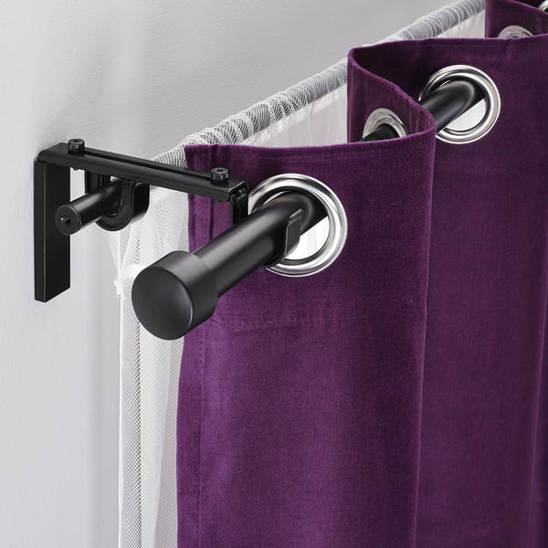 Purple curtains with black rod holders, showcasing double rod system.