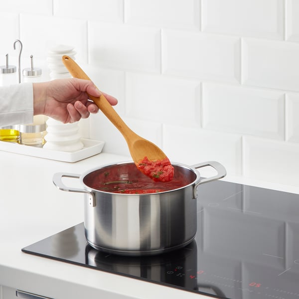 Cooking sauce on stove.