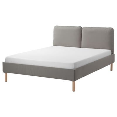 A grey upholstered bed, SAGESUND, with a sloped headboard and two pillows, set against a white background.