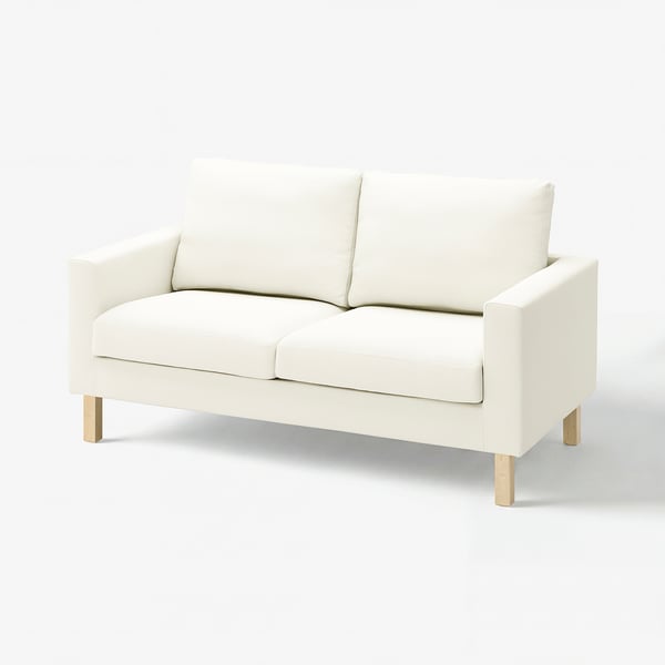 A white SALTSJÖBADEN sofa with light wood legs, offering a clean and modern look.