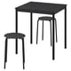 Black sandberg table and stools set. Square table, round stools with metal legs, modern minimalist design.