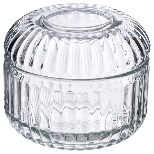 Clear glass container with ridged design for bathroom storage.