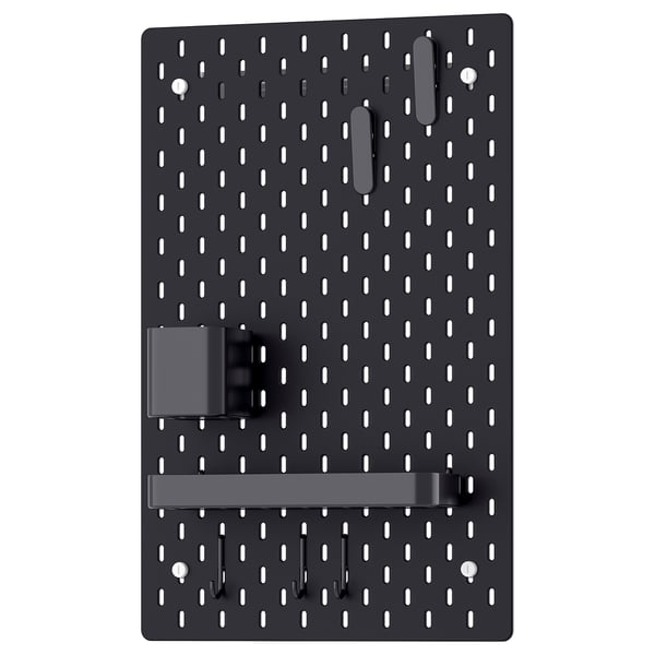 A black SKÅDIS pegboard with multiple hooks and holders. It is a practical organisation tool with a rectangular shape and evenly spaced holes.
