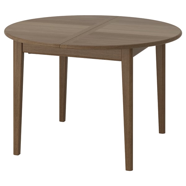 Round brown dining table with wooden legs, extending for 4-6 seats.