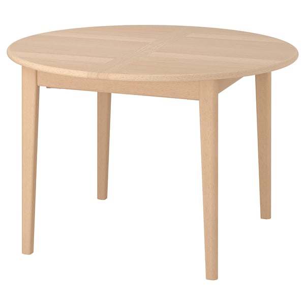 A SKANSNÄS light wood dining table with a round shape and natural finish. It has four tapered legs and an extendable centre for added seating.