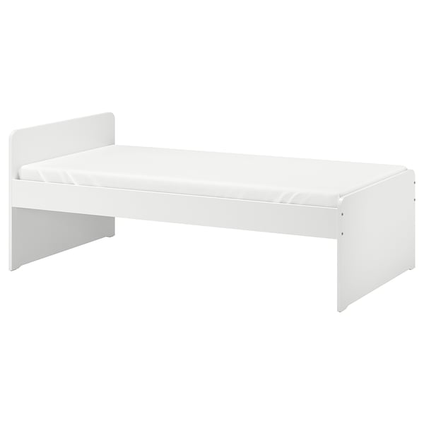White, modern kids bed with rounded corners and white mattress. Simple, clean design ideal for minimalist rooms.
