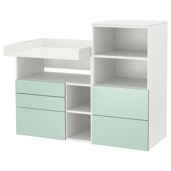 Small white and light green changing table and storage unit with drawers and shelves. Modern and practical.