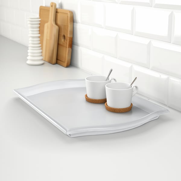 White serving tray with handles, holding two coffee cups and saucers. Ideal for carrying items to save trips.
