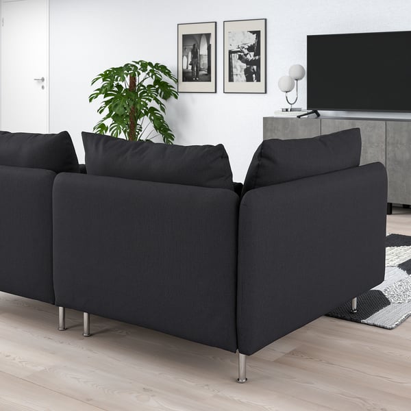 Modern grey SÖDERHAMN sofa with deep seats and high metal legs, positioned in a living room with a tv and plant.