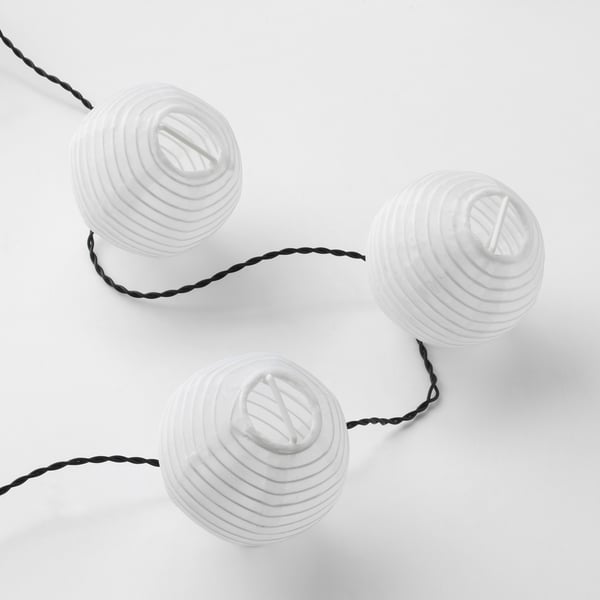 Three spherical, textured lanterns linked by a black cable, showcasing a quality, eco-friendly design.