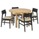 A STOCKHOLM 2025 dining set with a round oak table and four black chairs with woven seats.