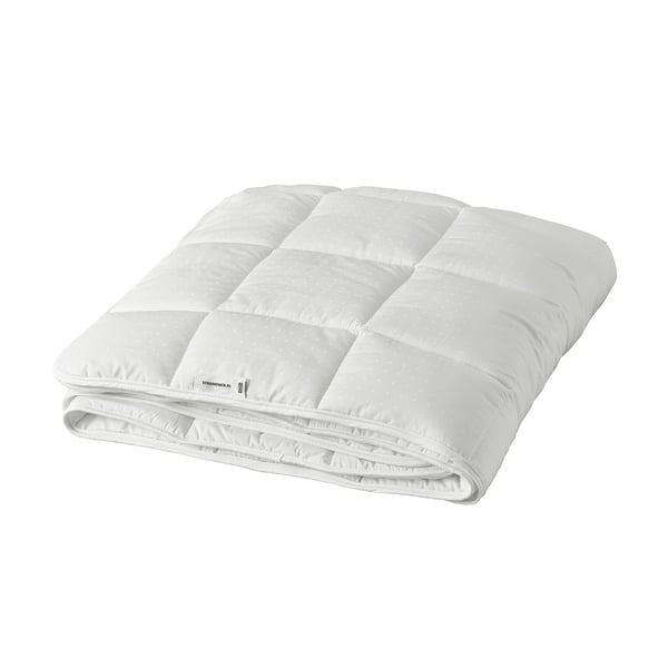 A white STRANDMOLKE duvet, neatly folded with a smooth, soft texture, showcasing its lightweight and fluffy design.
