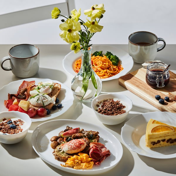 Dinnerware set with plates, bowls, cups. Glass dishes, wavy edges, for serving meals. Safe for microwave, dishwasher.