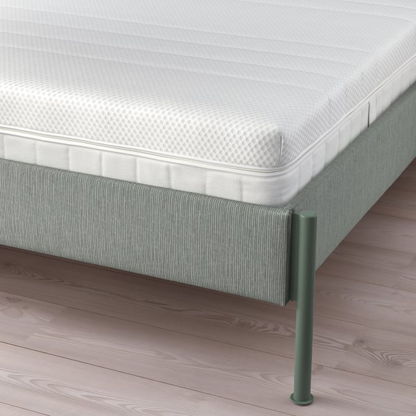Modern bed frame with adjustable sides and padded headboard. Grey-green striped fabric and metal legs.
