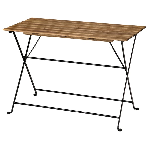 TÄRNÖ: folding outdoor table, rectangular, brown wood top, black metal legs, sturdy design.