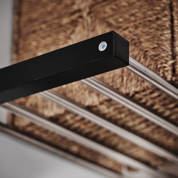 Black wooden coat rack with metallic hooks, showing quality craftsmanship and sturdy design.
