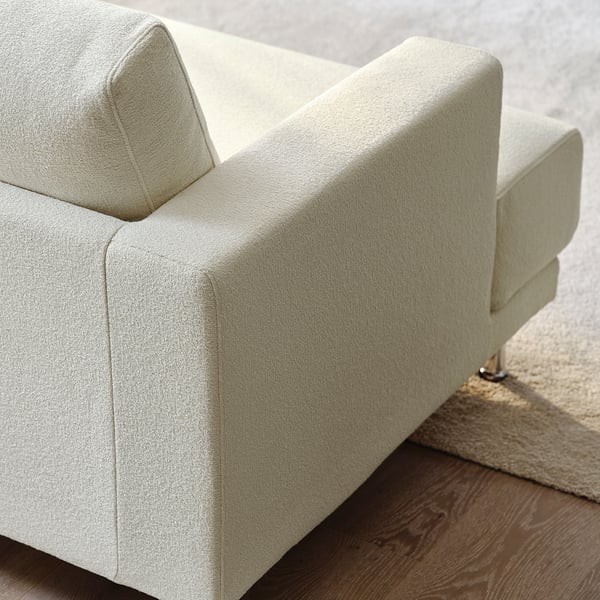 Light beige sofa, modern design, sturdy fabric, comfortable cushions, wooden legs, stylish.