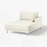 An UPPÅKRA sofa in white, featuring a modern design with a bouclé fabric cover, offering comfort and style.