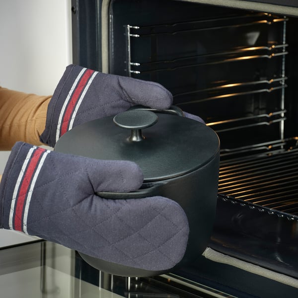 Cooking with cast iron, oven mitts.