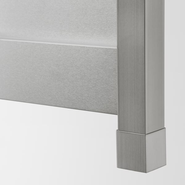Stainless steel kitchen cabinet detail; smooth, sleek, industrial finish.