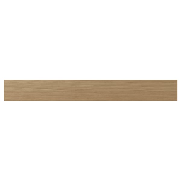 A VEDHAMN kitchen drawer front in natural wood. It is rectangular with visible oak grain, framed by solid wood, and lacquered for durability.
