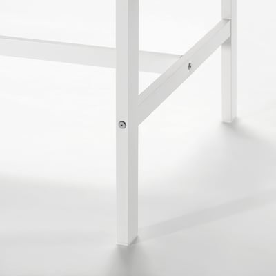 Close-up of white VIHALS table leg with bolt detail
