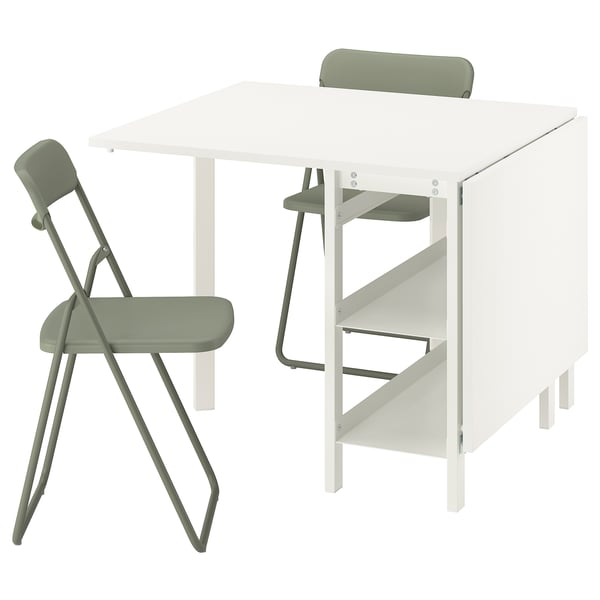 Foldable dining table with 2 shelves & 2 green chairs, minimalist & modern for small spaces.