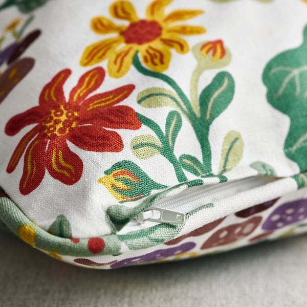 Floral cushion cover with vibrant colours, zip detailing, and durable fabric texture.