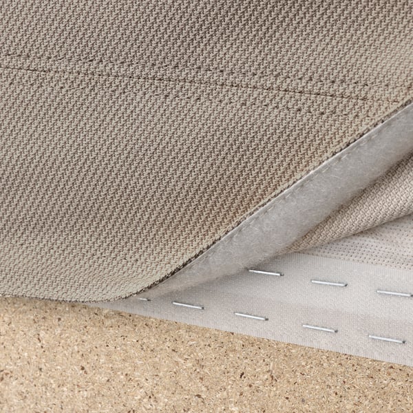 Close-up of VIMLE sofas removable, machine-washable hallarp fabric cover, showcasing stitching and lining.