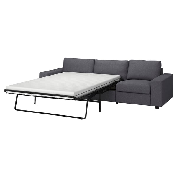 Modern grey convertible sofa with extendable bed, sleek metal legs, and comfortable cushions.