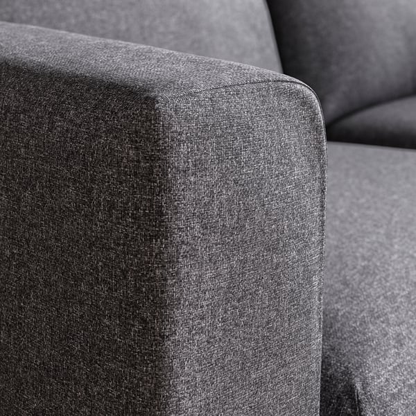 Close-up of plush, grey cushioned sofa, showcasing smooth fabric texture, highlighting comfort and durability.