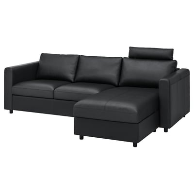 Modern black l-shaped sofa with storage and headrest.